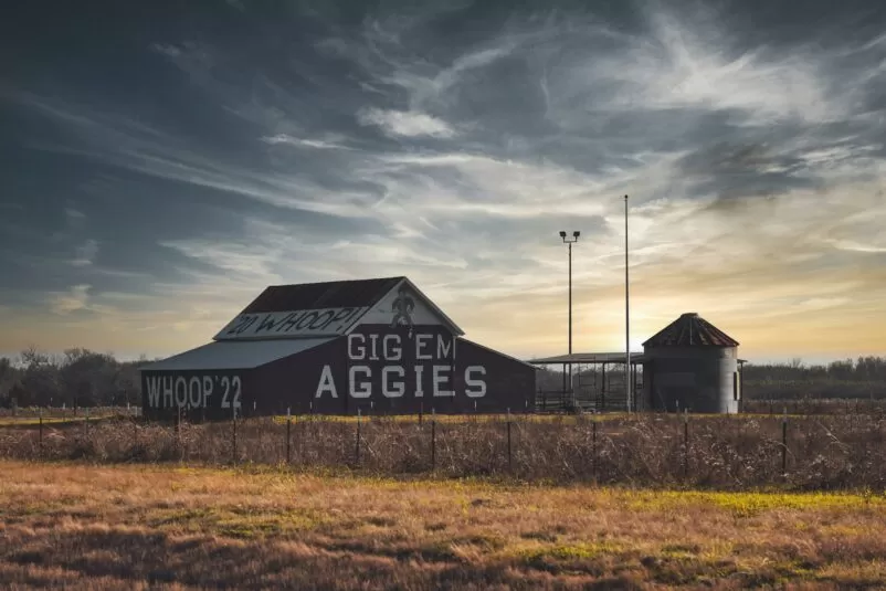 Texas A&M slogan painted on a building